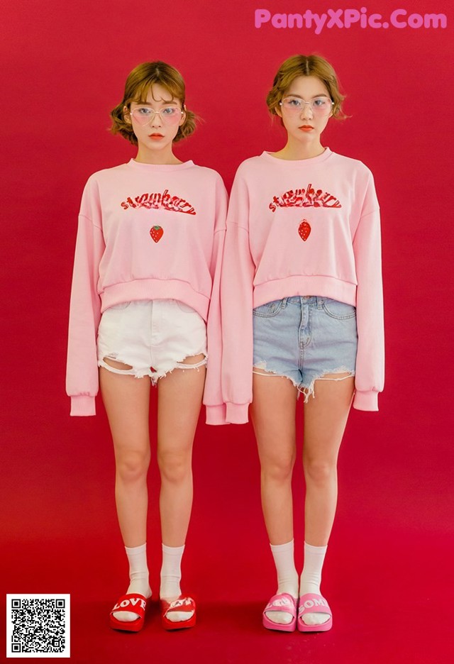 A couple of young women standing next to each other.
