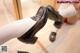 A pair of black shoes sitting on top of a wooden floor.