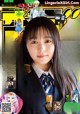 A magazine with a girl in a school uniform on the cover.